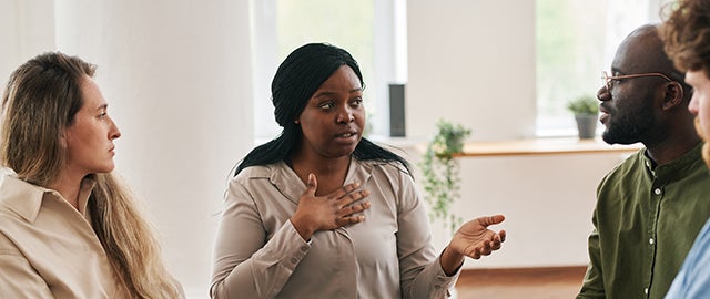 Counselor working in a therapy group, representing field placement services as part of the online Counseling program at American International College