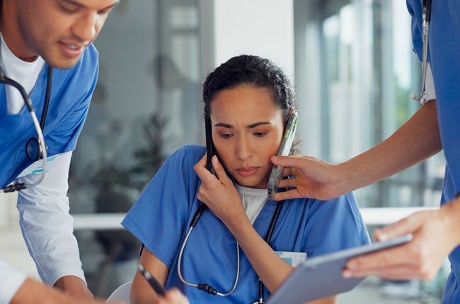 busy nurse overwhelmed by work