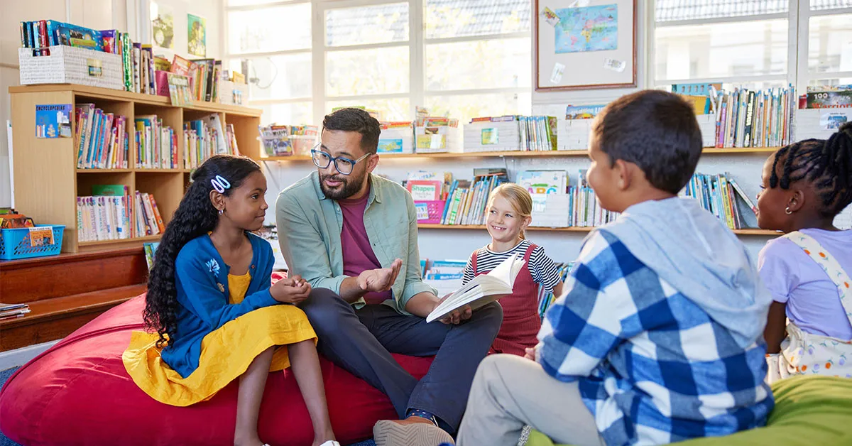A teacher reads to a group of students