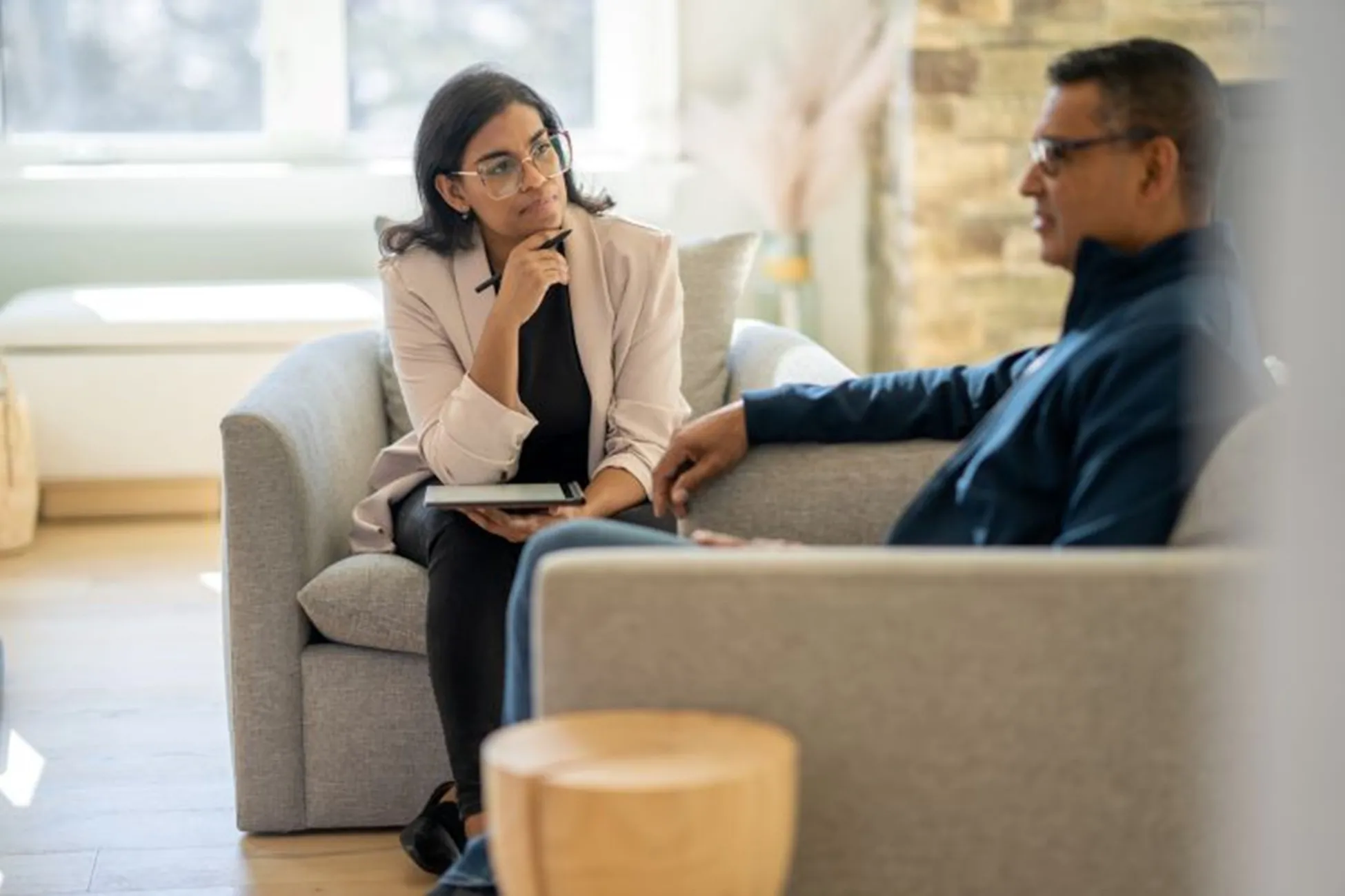A counselor meets with a patient